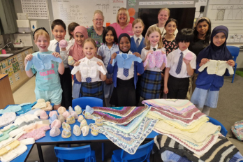 Julia Austin, Neonatal Unit Nursery Nurse with volunteer Jean Hinchliffe and children from the after-school knitting club at Bewsey Lodge Primary School.