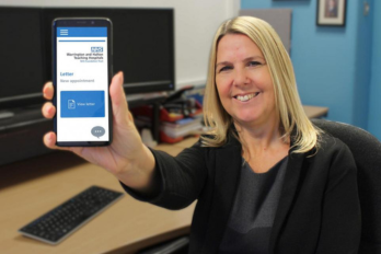 Staff member showcasing the page on the NHS App for patients to manage their appointments.