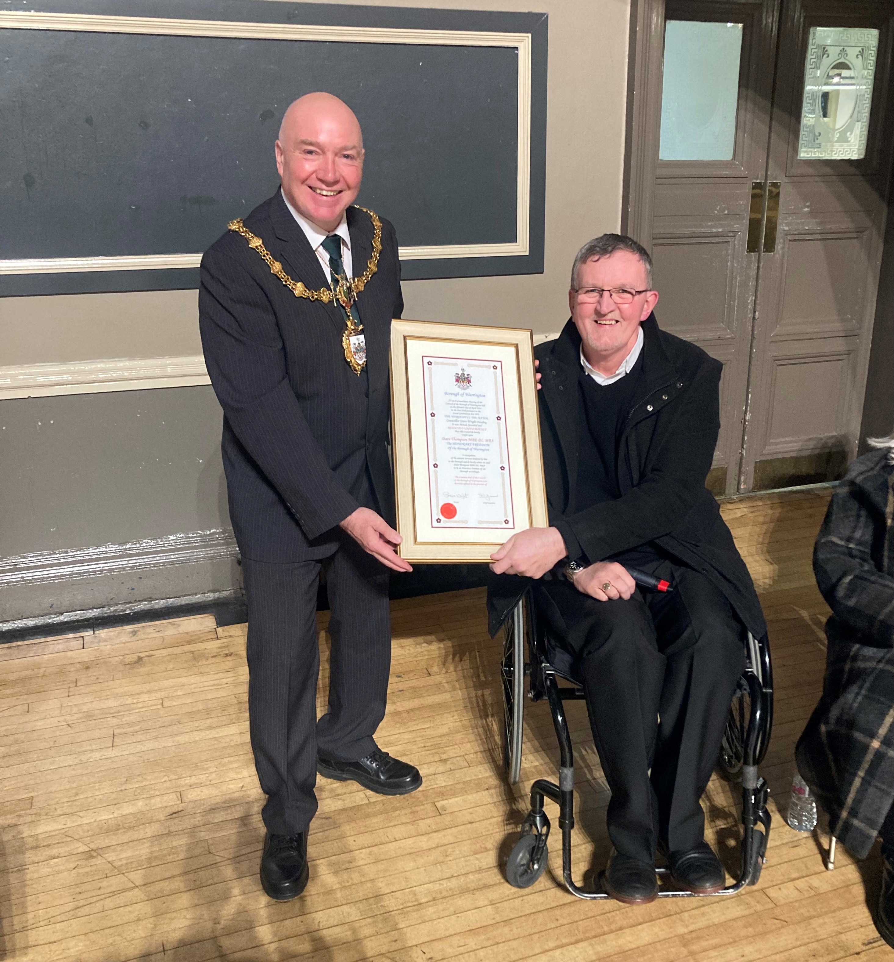 Dave Thompson receiving his Honorary Freeman certificate from Mayor Steve Wright.