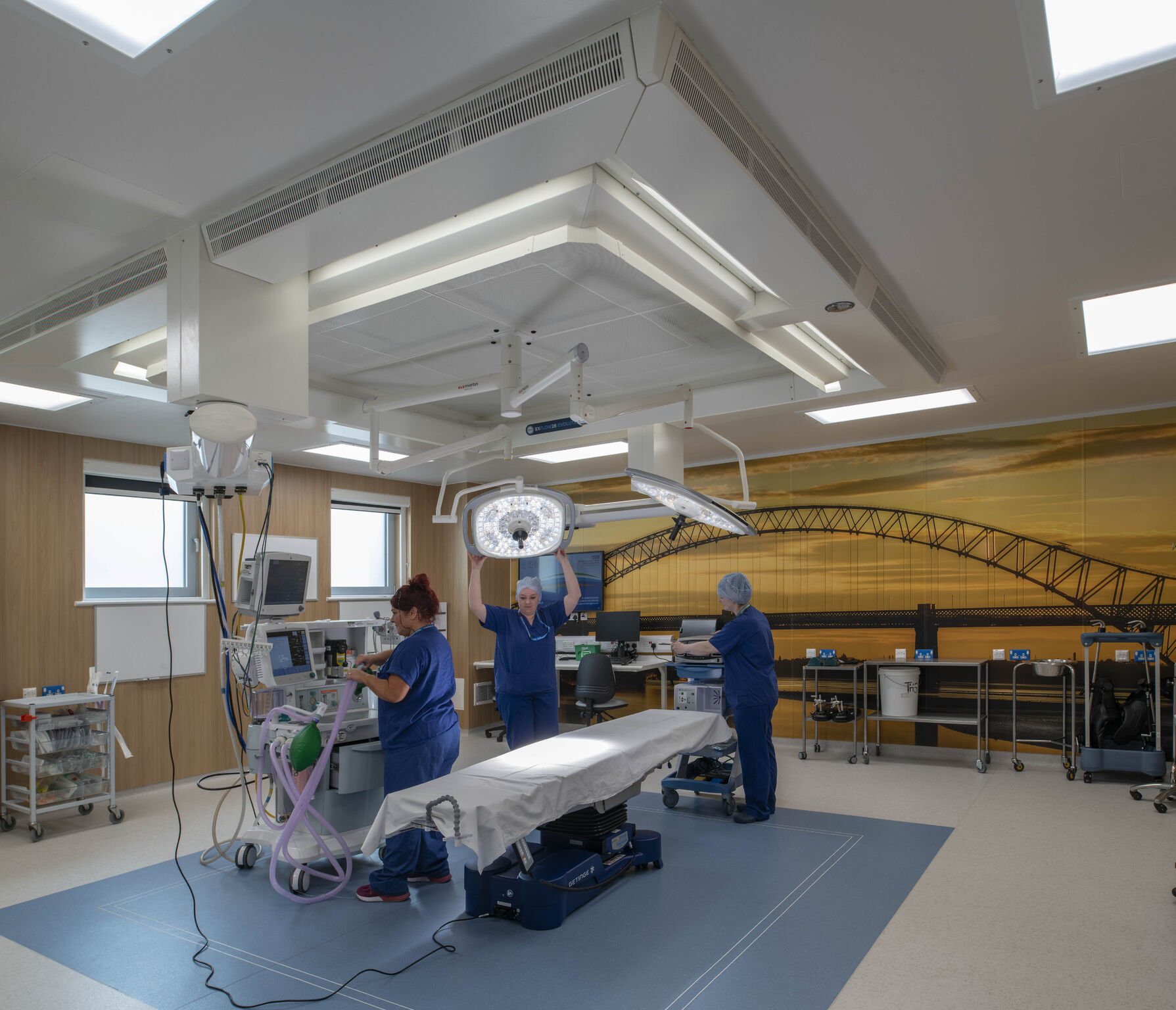 Photo wall and medical equipment in the new theatre.